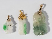 THREE CARVED JADEITE PENDANTS