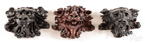 THREE CARVED LION HEAD WALL