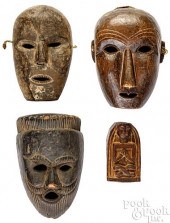 THREE CARVED NEPALESE MASKSThr