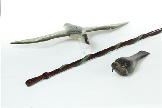 THREE CARVED PIECES AND A CAST IRON