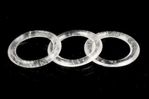 THREE CARVED ROCK CRYSTAL BI DISC