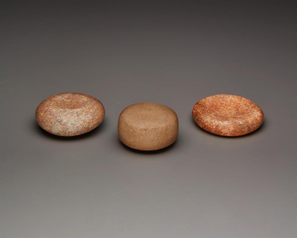 THREE CARVED STONE