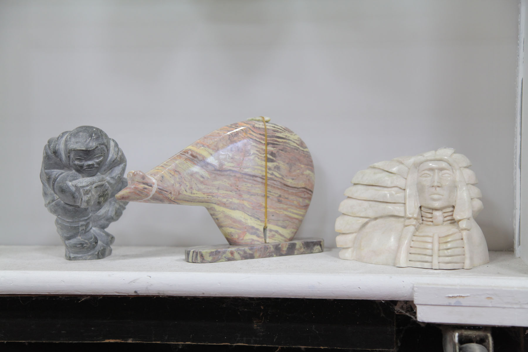 THREE CARVED STONE FIGURES. 