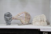 THREE CARVED STONE FIGURES.  A