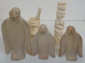 THREE CARVED STONE PENGUINS, A