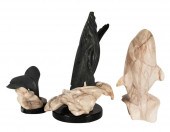 THREE CARVED STONE WHALE SCULP