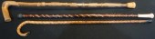 THREE CARVED WOOD CANESThree C