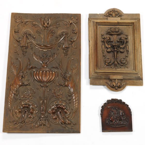 THREE CARVED WOOD PANELS  One small