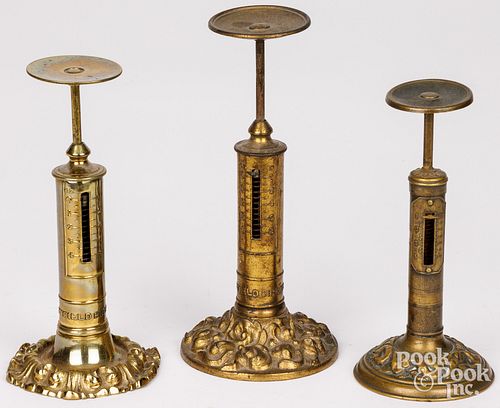 THREE CAST BRASS CANDLESTICK POSTAL