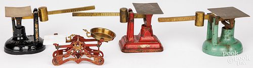 THREE CAST IRON AND BRASS COUNTER