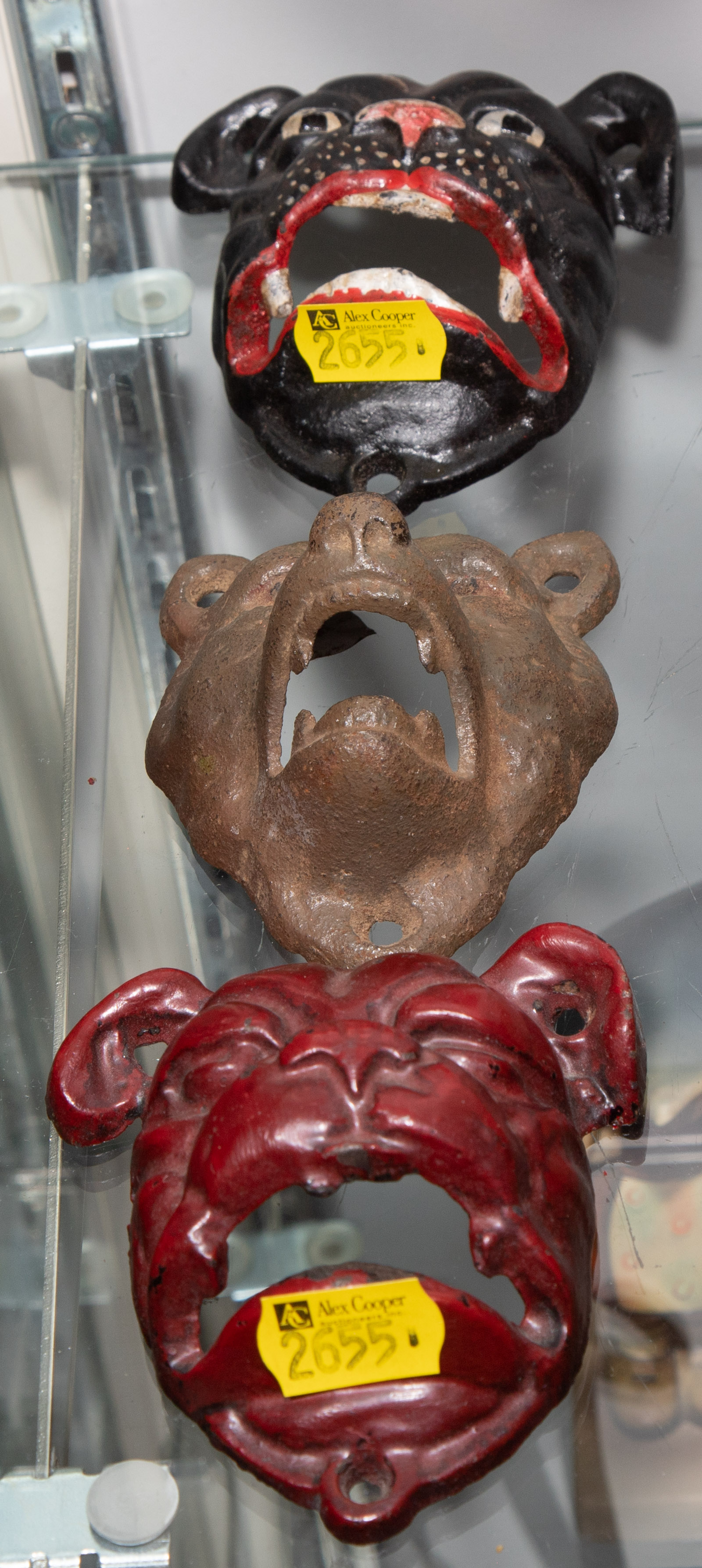 THREE CAST IRON ANIMAL HEAD