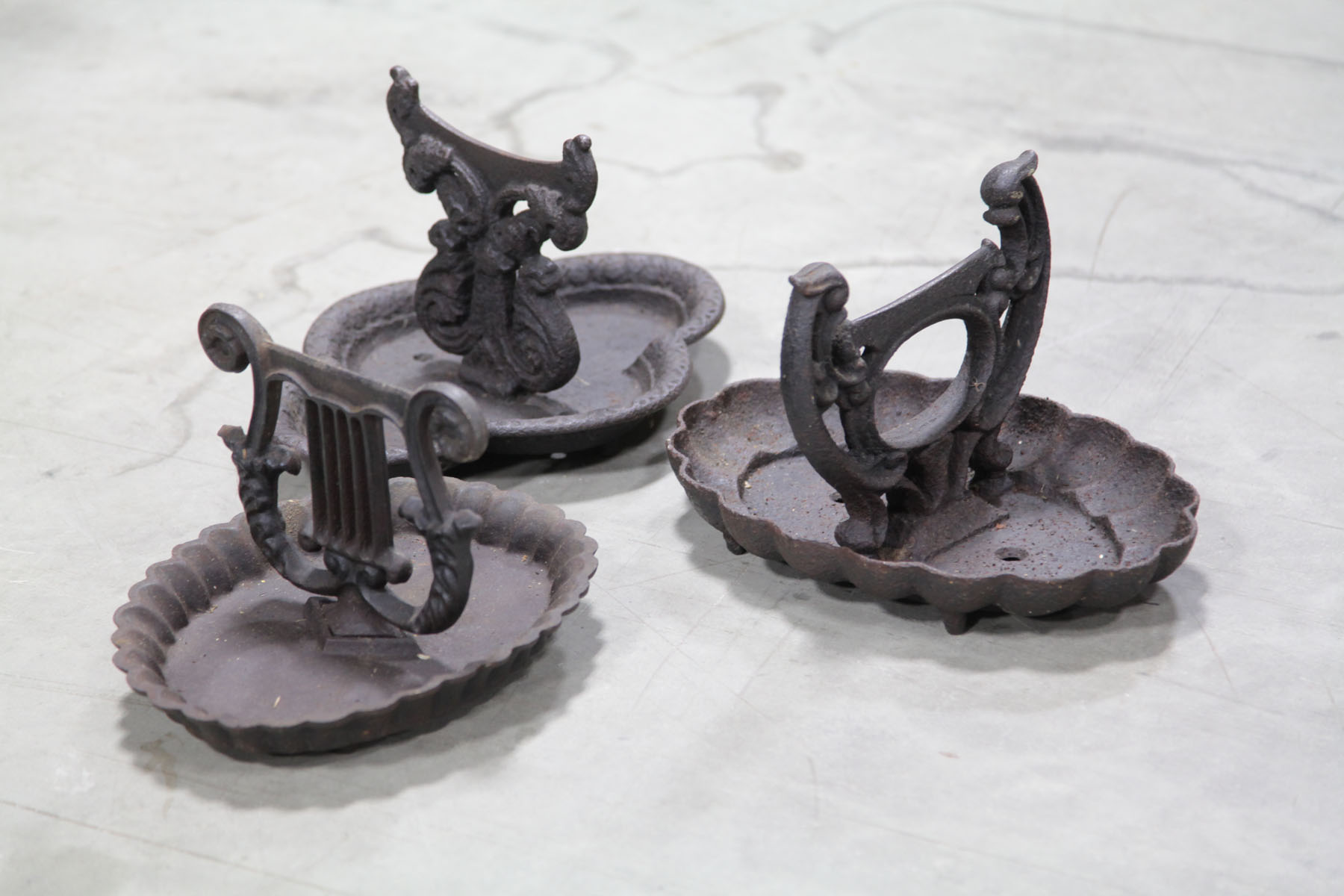 THREE CAST IRON BOOT SCRAPERS. 