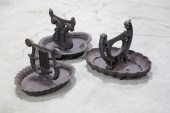 THREE CAST IRON BOOT SCRAPERS.