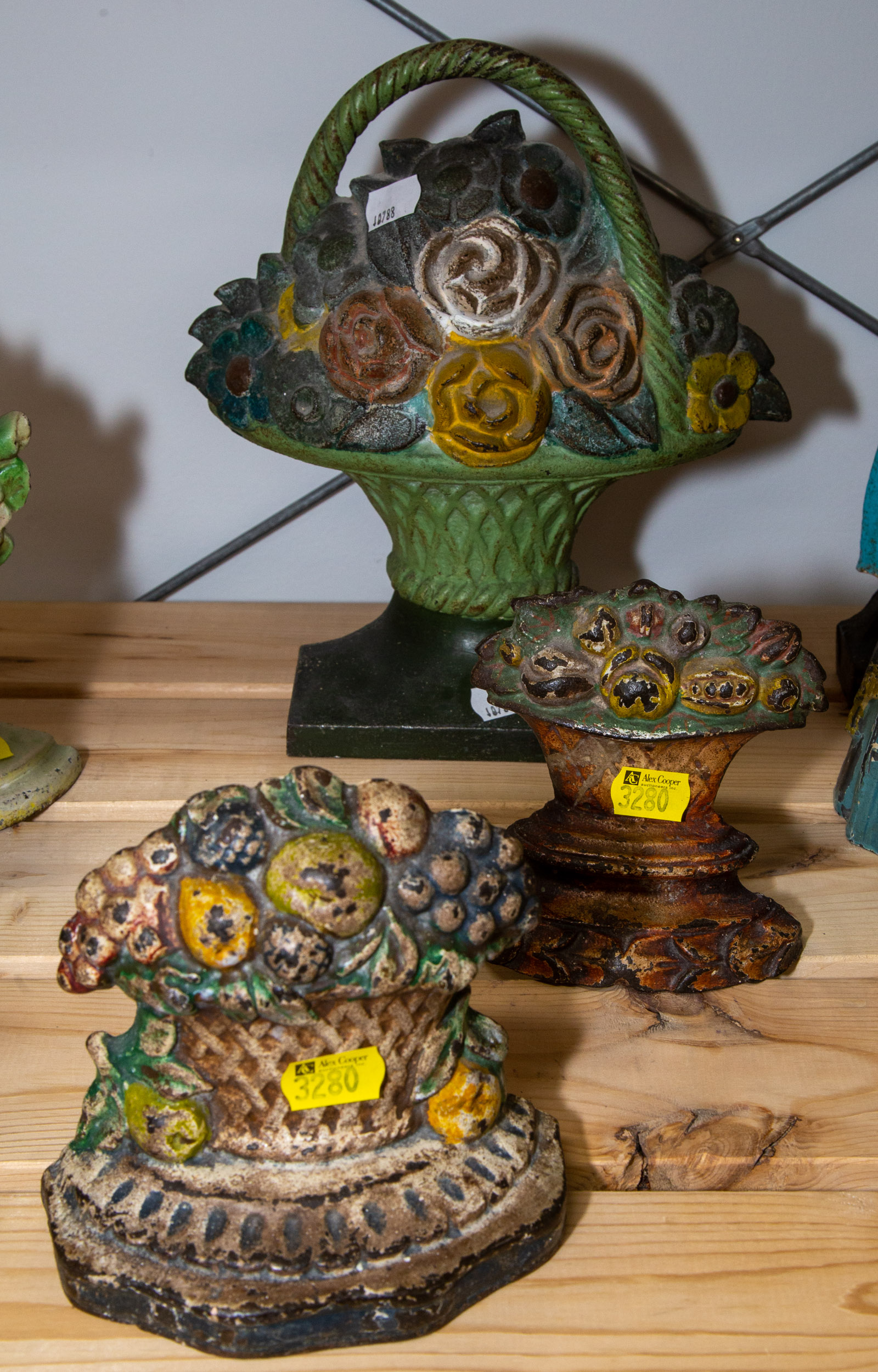THREE CAST IRON DOOR STOPS