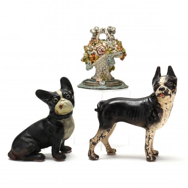 THREE CAST IRON DOORSTOPS A