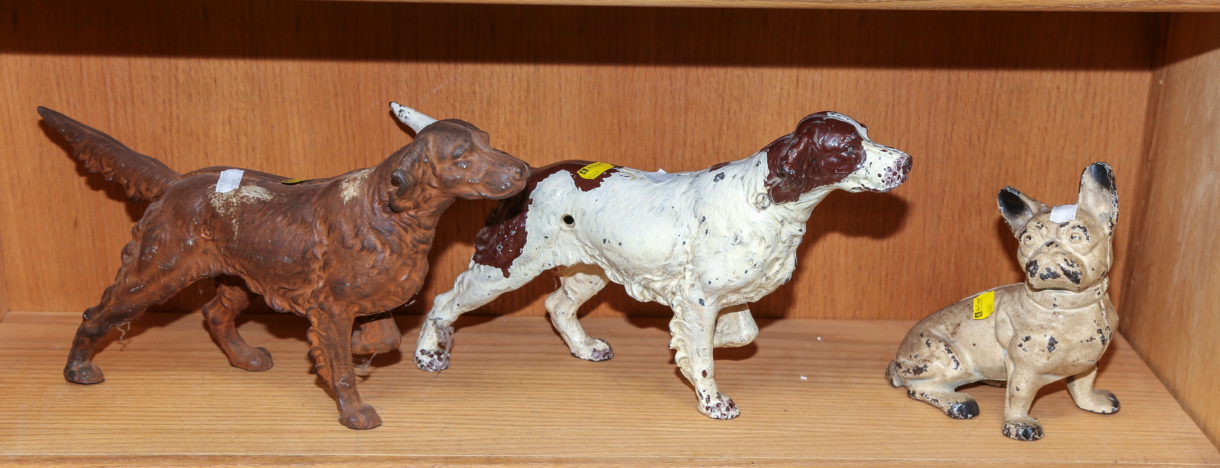 THREE CAST IRON DOORSTOPS