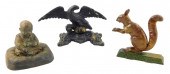 THREE CAST IRON DOORSTOPS: ONE
