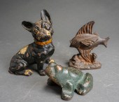 THREE CAST IRON DOORSTOPS: PAI