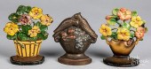THREE CAST IRON DOORSTOPSThree