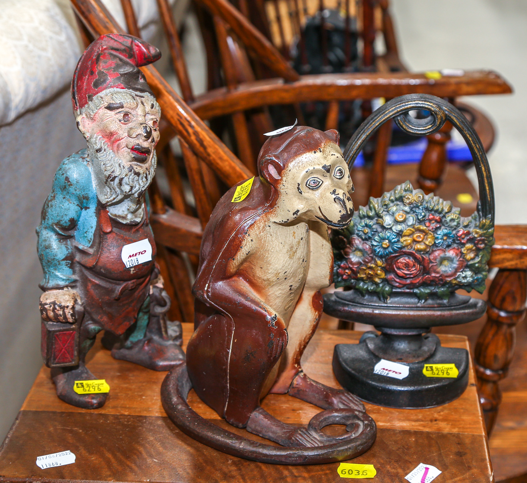 THREE CAST IRON FIGURAL DOORSTOPS