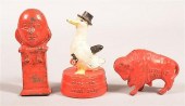THREE CAST IRON FIGURAL STILL