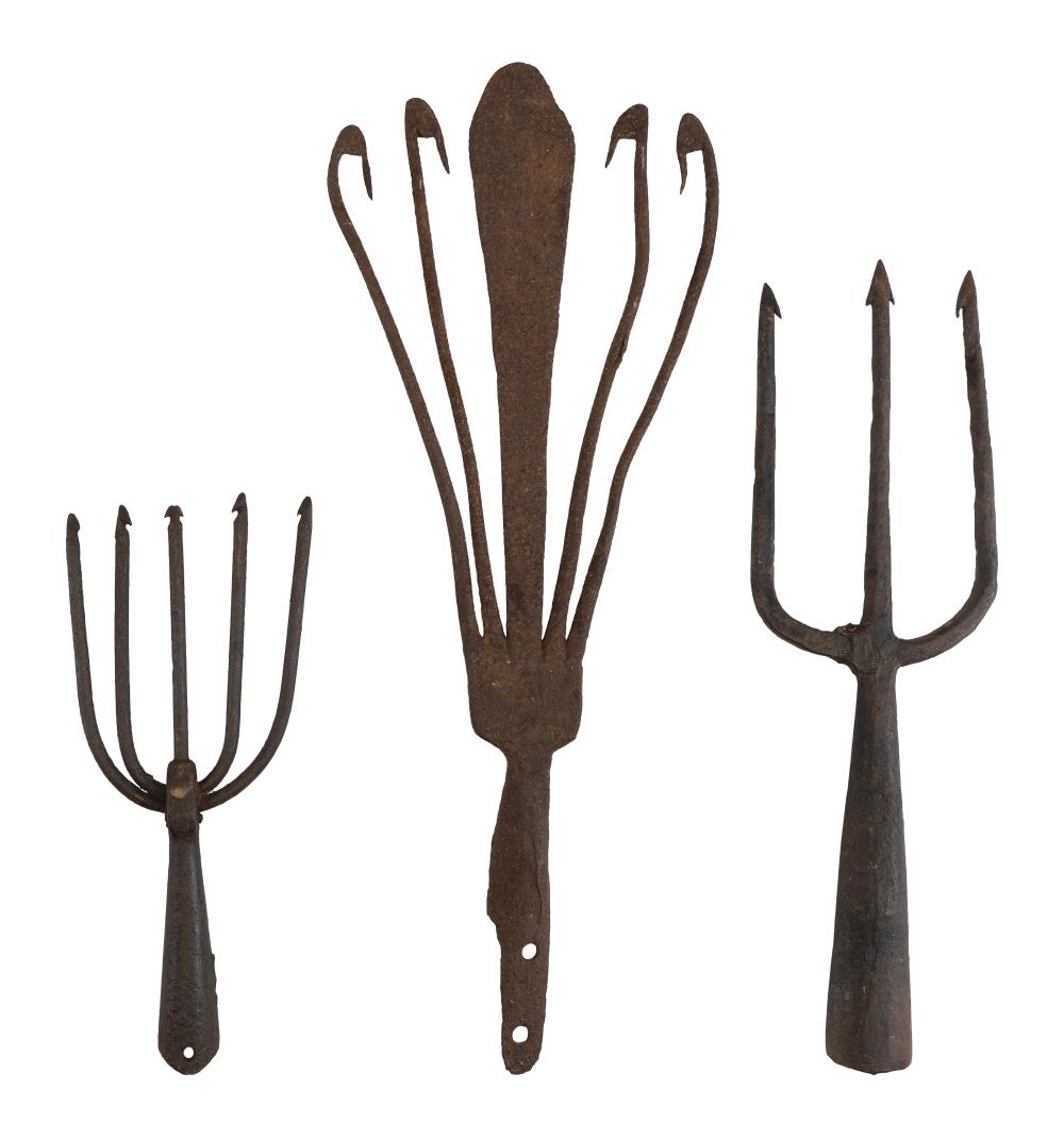 THREE CAST IRON FISH AND EEL SPEARS