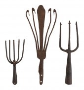 THREE CAST IRON FISH AND EEL S