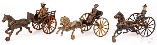 THREE CAST IRON HORSE DRAWN