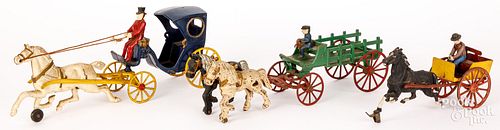 THREE CAST IRON HORSE DRAWN