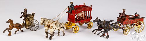THREE CAST IRON HORSE DRAWN