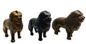 THREE CAST IRON LION STILL BAN