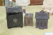 THREE CAST IRON PENNY BANKS. '