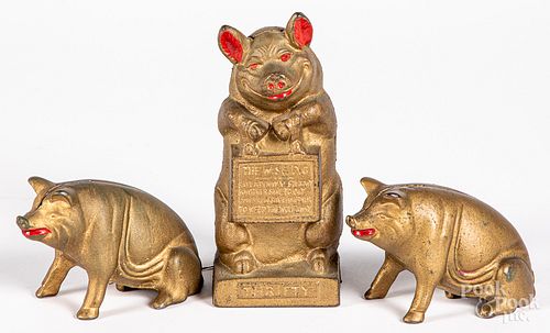 THREE CAST IRON PIG BANKSThree cast