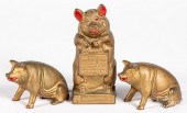 THREE CAST IRON PIG BANKSThree