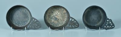 Three cast iron porringers: two