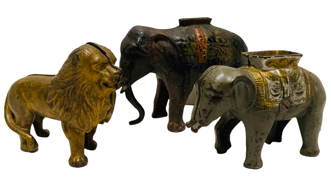 THREE CAST IRON STILL BANKS BY