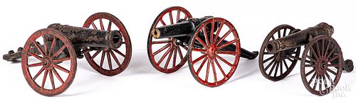THREE CAST IRON TOY CANNONSThree