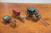 THREE CAST IRON WAGON TOYS.  A