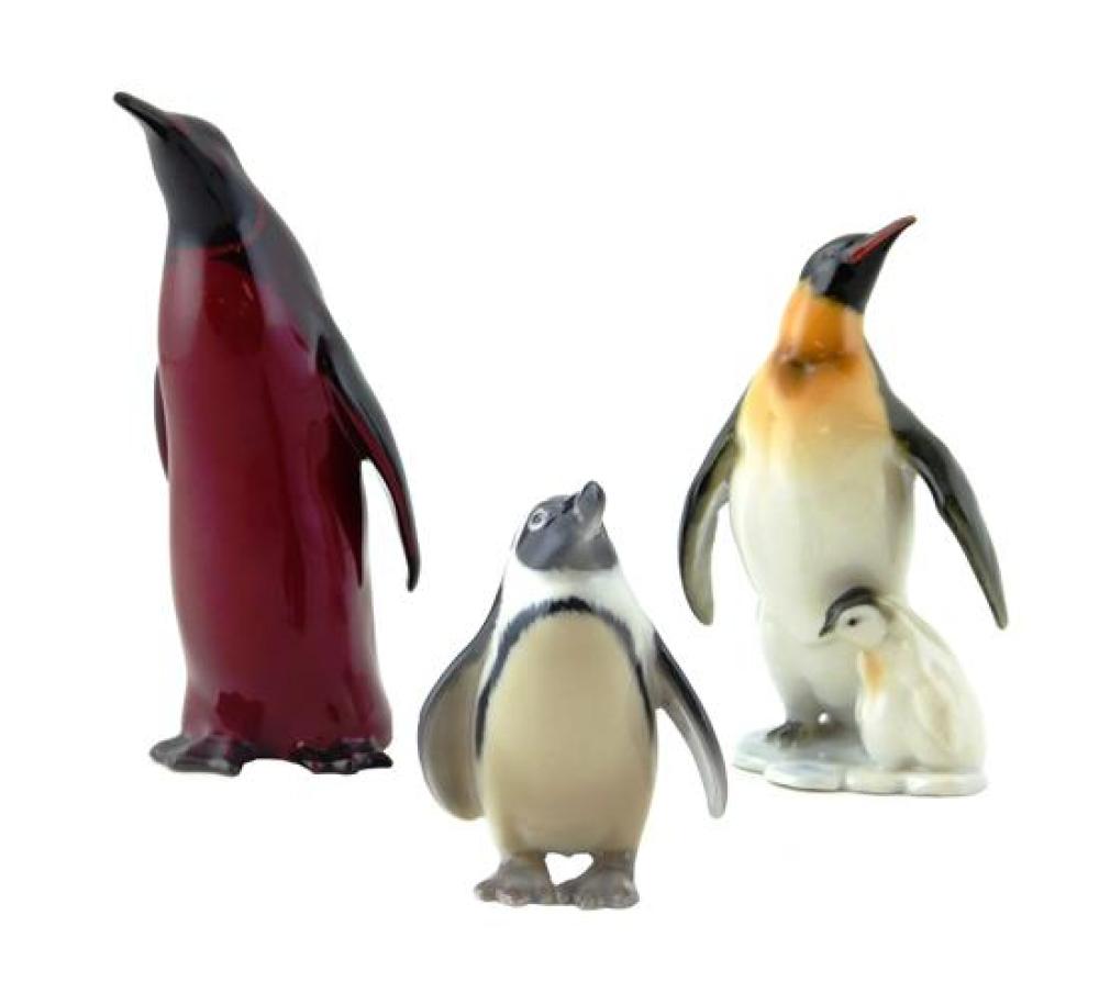 THREE CERAMIC PENGUIN FIGURINES,