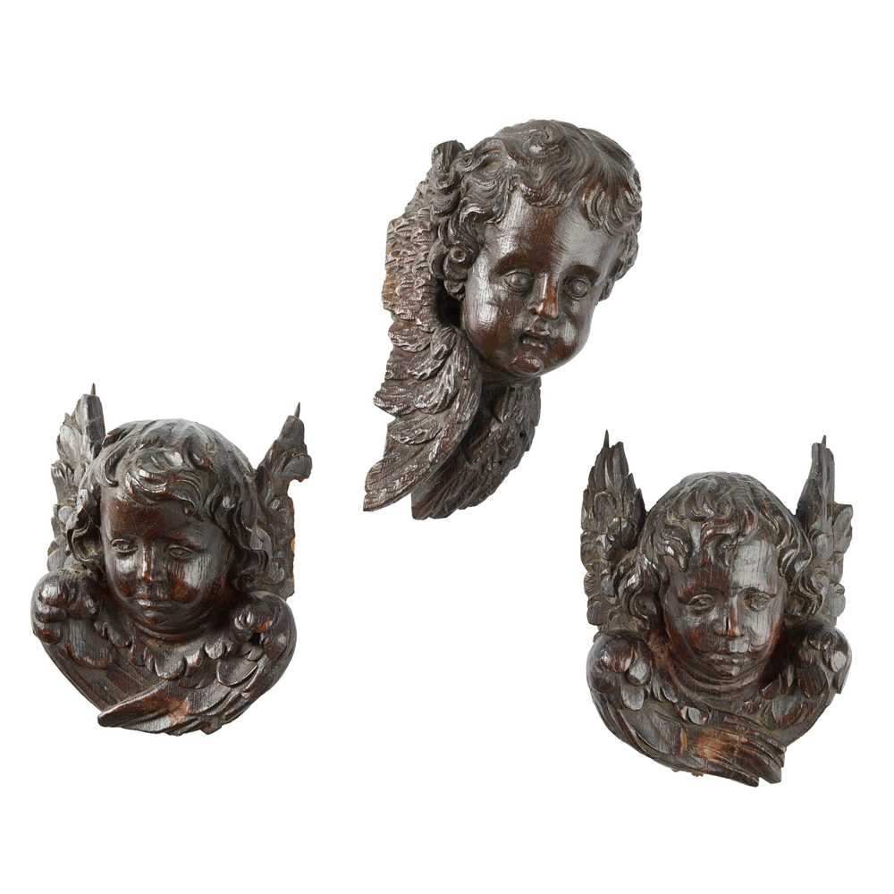 THREE CHERUBIM MASK CARVINGS