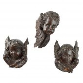 THREE CHERUBIM MASK CARVINGS
1