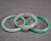 THREE CHINESE JADEITE BANGLES,