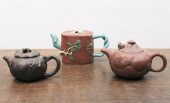 THREE CHINESE ZISHA WARE TEAPO