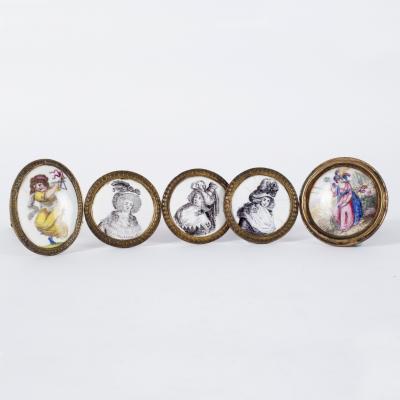 Three circular enamel roundels,