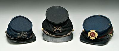 Three Civil War era kepis: one dark