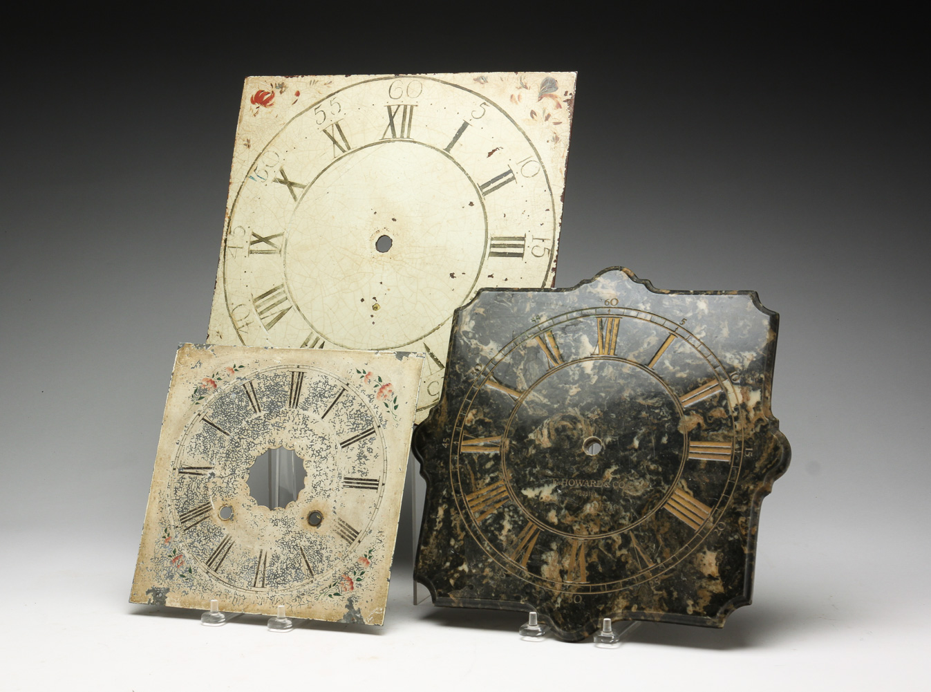 THREE CLOCK FACES INCLUDING E.