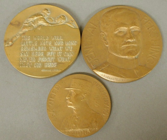 Three commemorative bronze