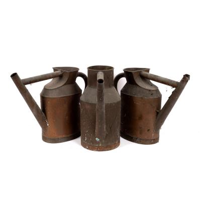 Three copper watering cans, 42cm