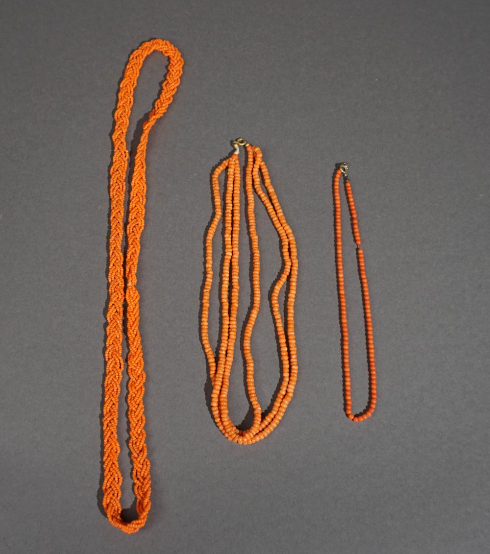 THREE CORAL BEADED NECKLACESThree