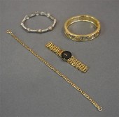 THREE COSTUME BRACELETS AND A